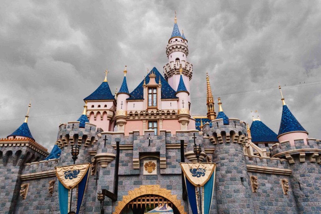 Cloudy day at Disneyland showing the castle in blue and pink