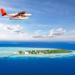 Seaplane flying over the Maldives islands